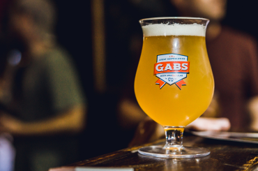 A GABS branded promotional beer glass