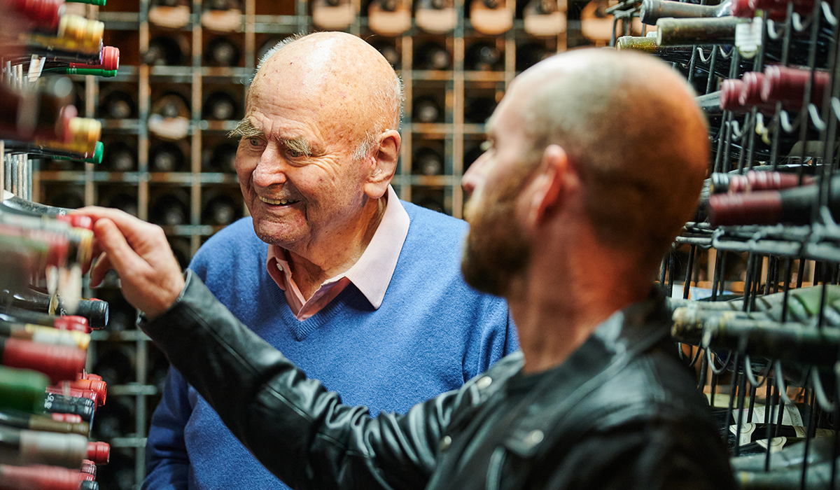 James and Campbell selecting wines in James' cellar