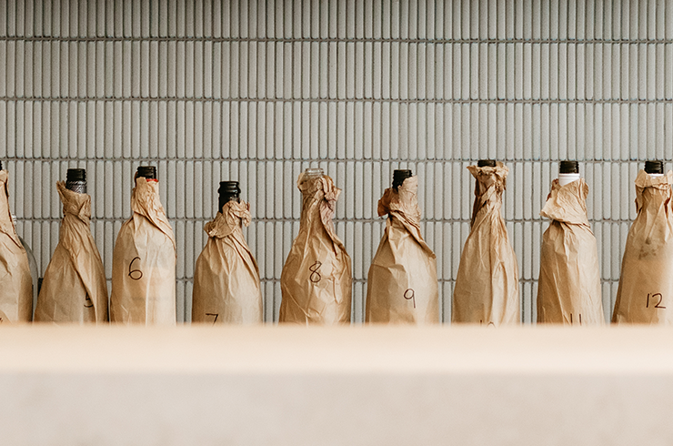 Wines in brown paper bags