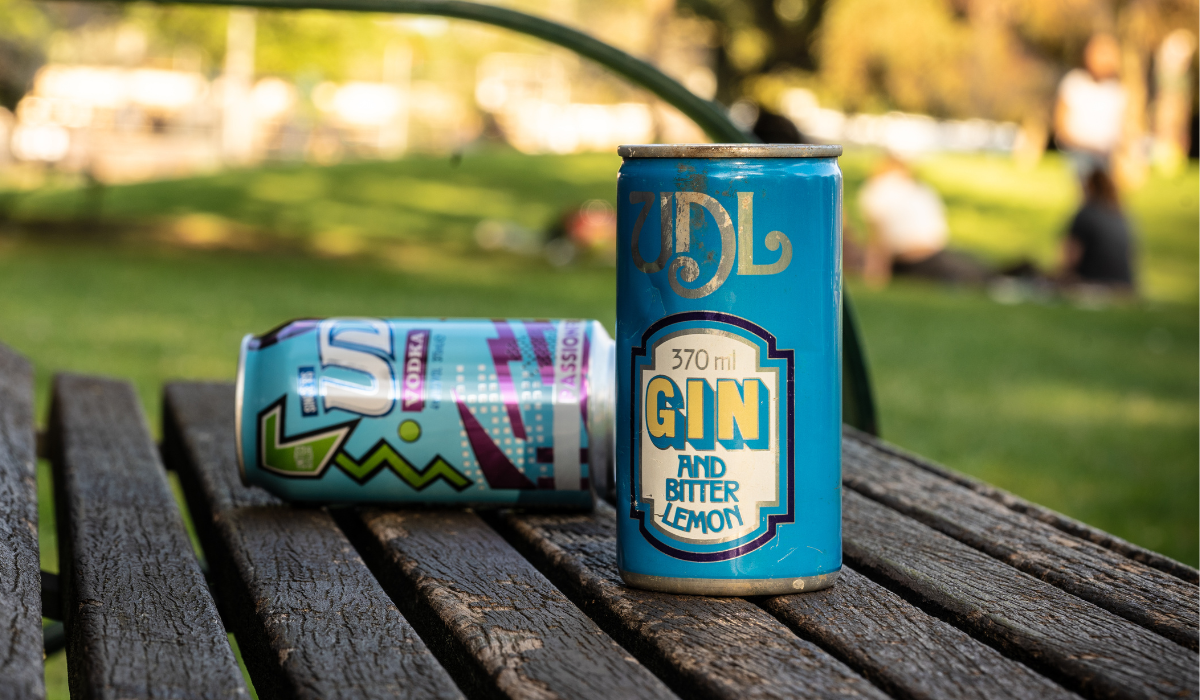 Vintage UDL cans on a park bench