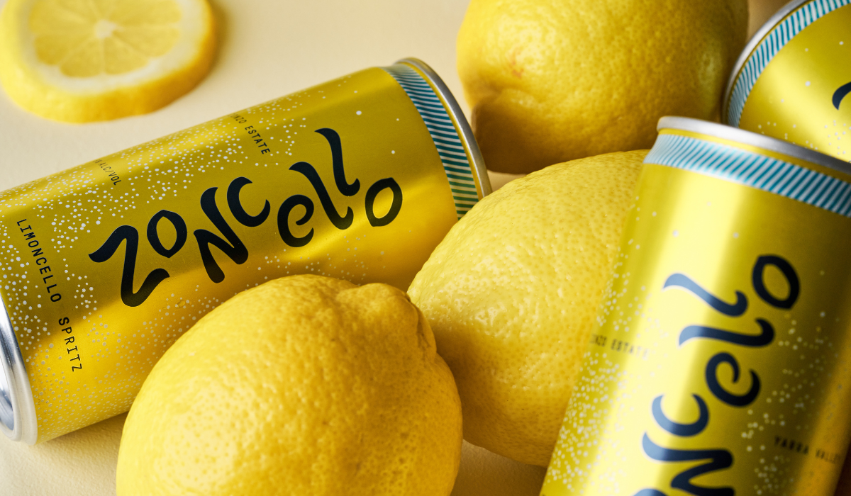 Yellow cans of Zoncello and fresh lemons