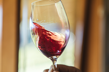 A glass of light red wine