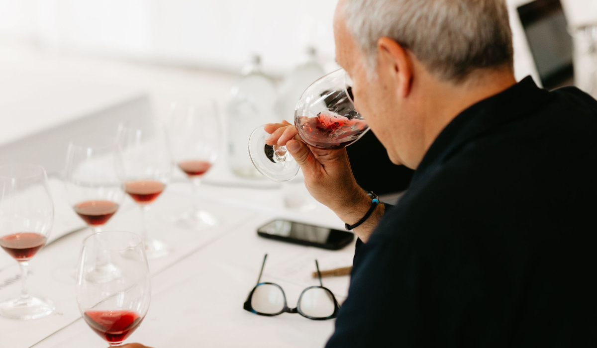 A man at a red wine tasting