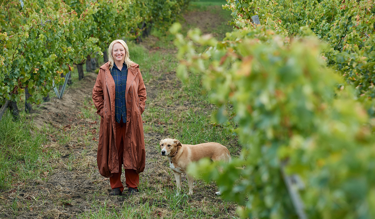 Vanya Cullen and her dog Solly in the vineyard