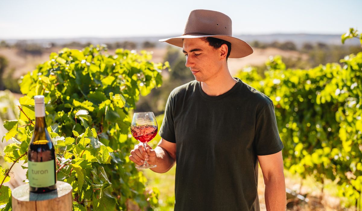 Turon White tasting pinot noir in the vineyard