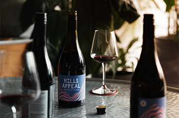 Bottles of red wine and glasses on a table