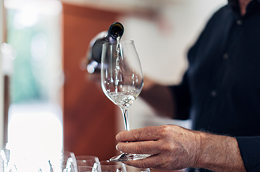 Bottle of Grosset riesling being poured into a glass.