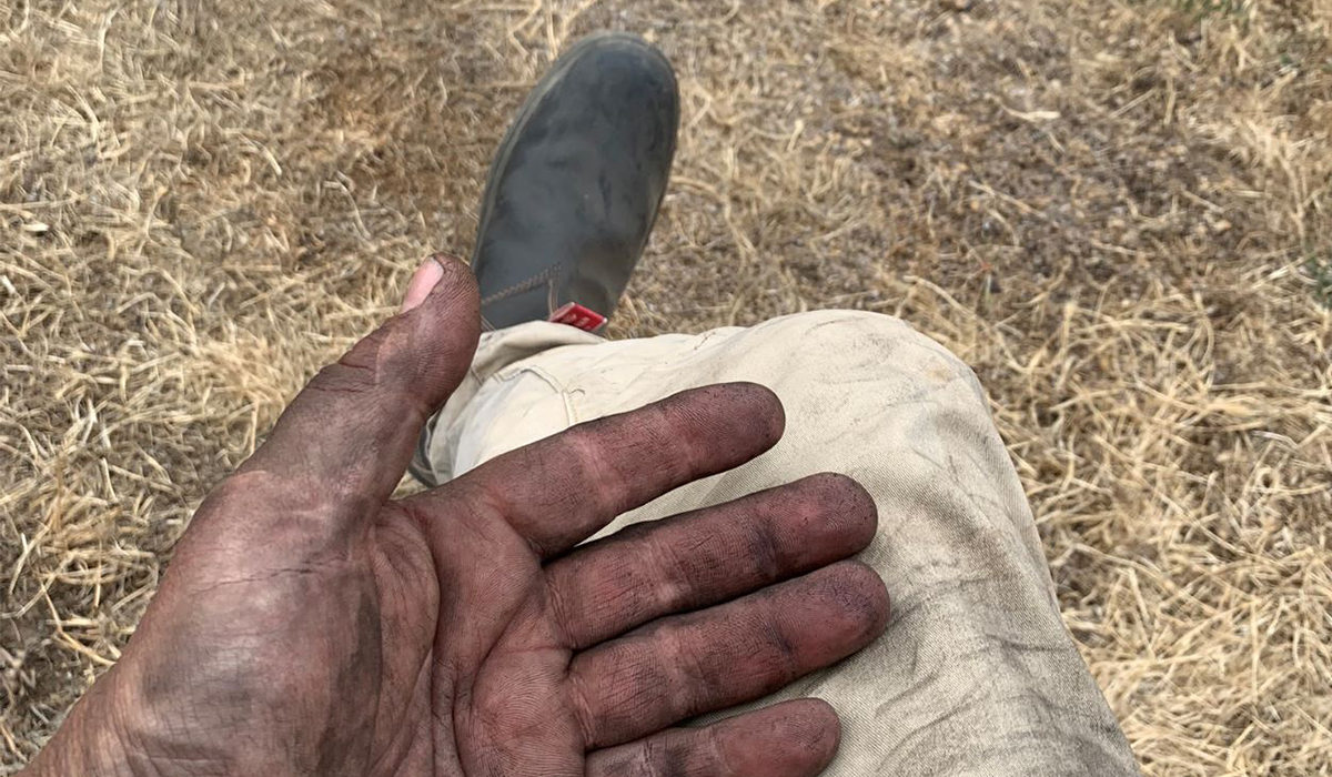 Ash covered hand