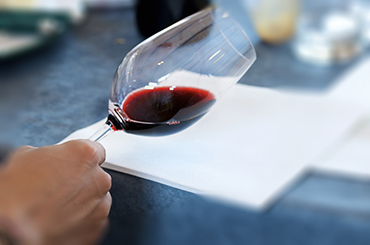 Checking a wine's colour against paper
