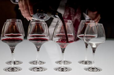 Line-up of wines being poured
