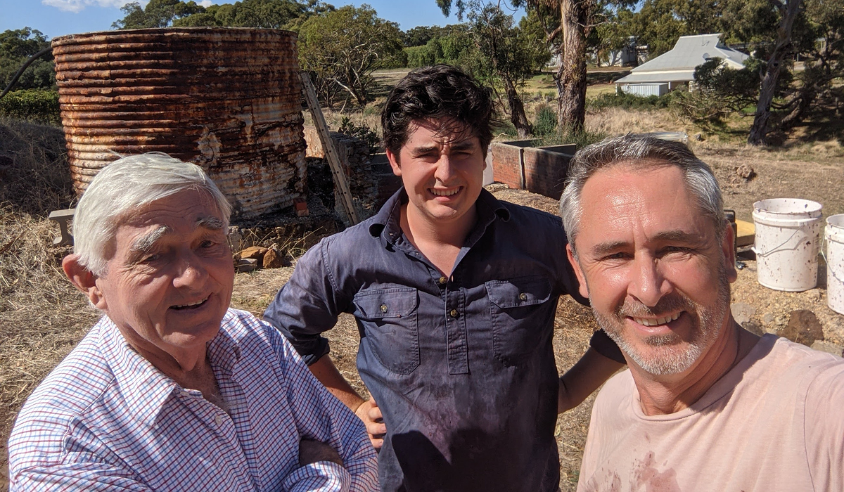 Three men pose for a selfie