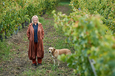 Vanya in the vineyard with her dog Soli.