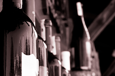 Black and white image of wine bottles