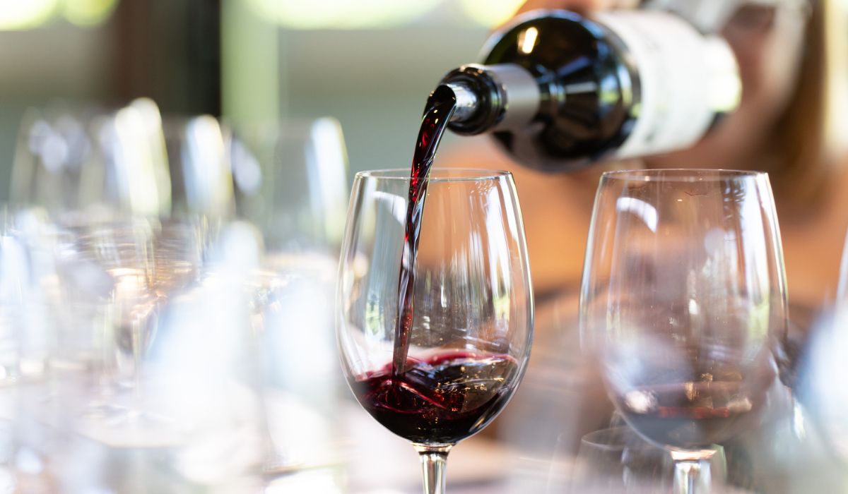 Red wine being poured into a glass