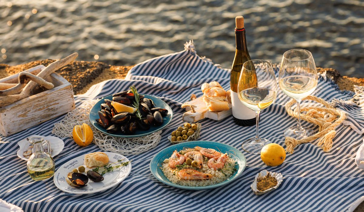 Beach picnic with white wine and seafood