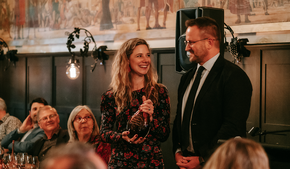 Anna Pooley receiving the 2022 Pinot Noir Challenge trophy