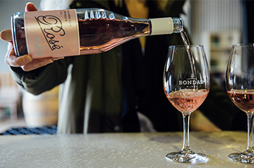 Bondar rose bottle being poured into a glass