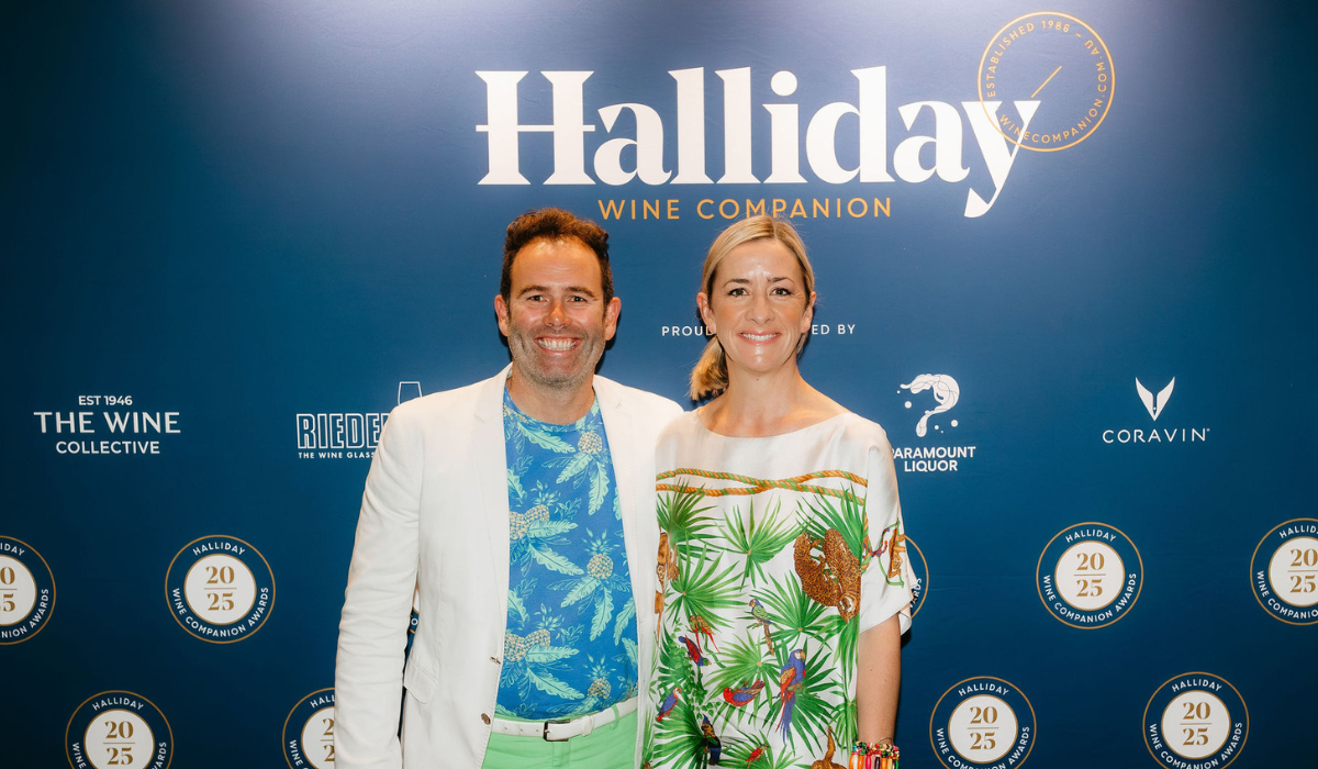 A man and a woman smile at an awards night