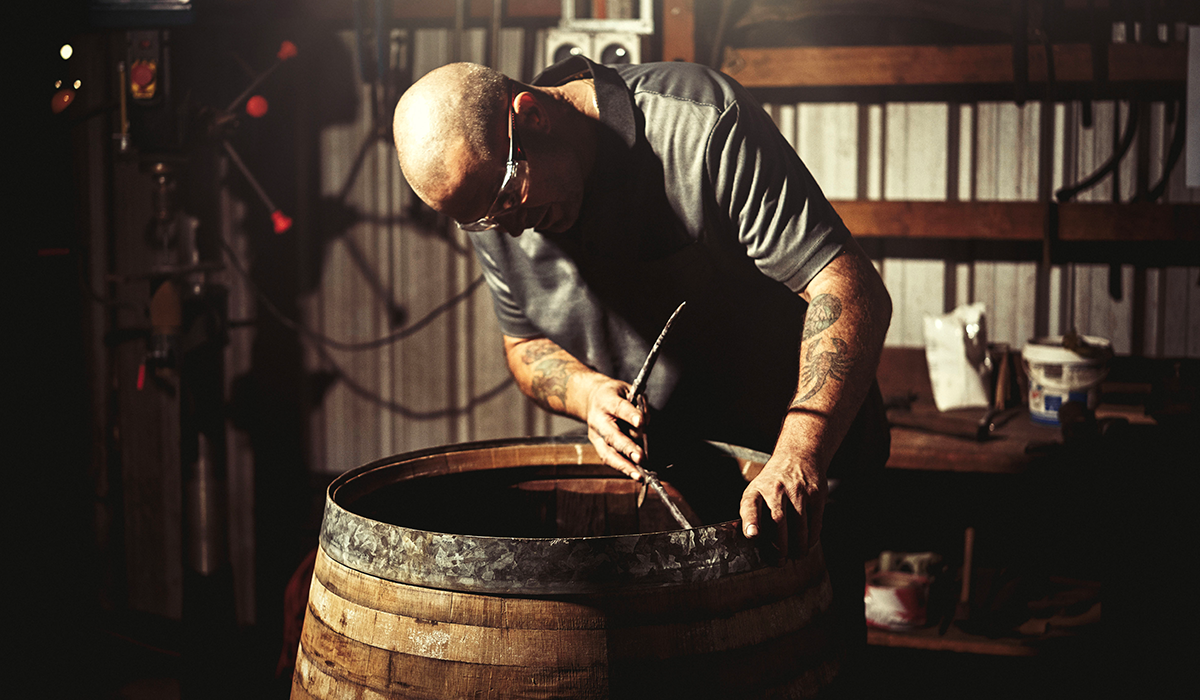 A man working on a wine cask