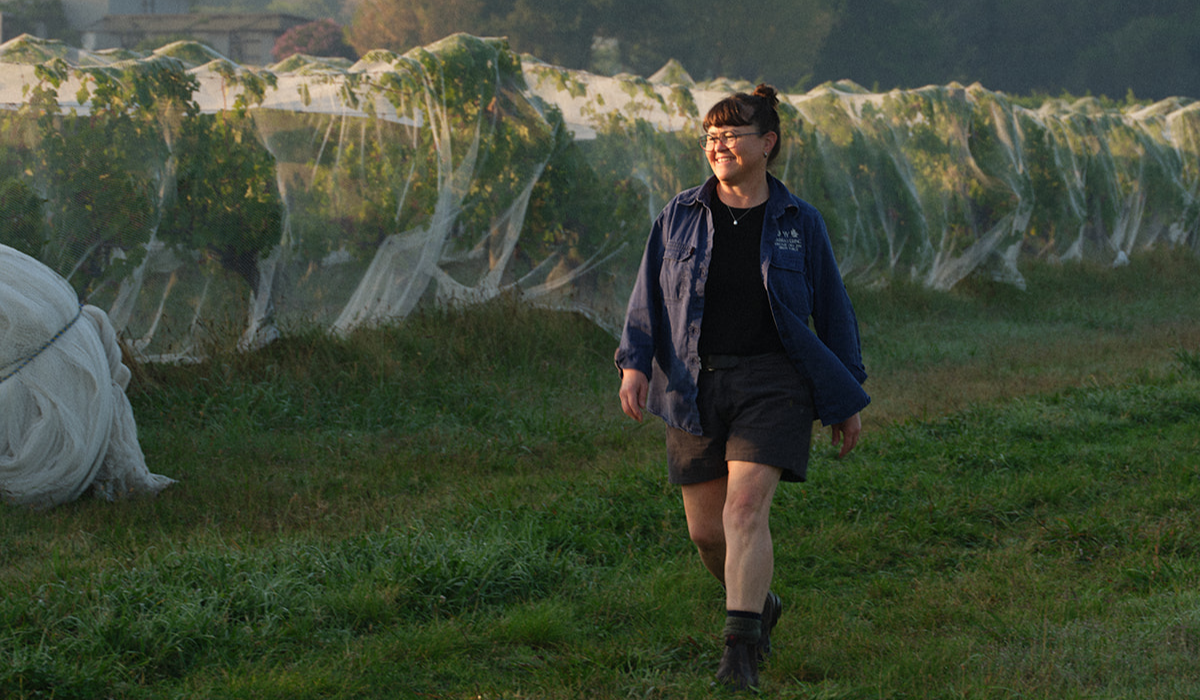 Sarah Crowe walking through the Yarra Yering vineyard 