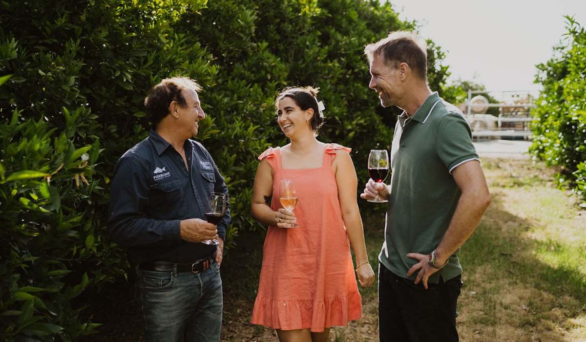 People drinking wine in Harvey Vineyard