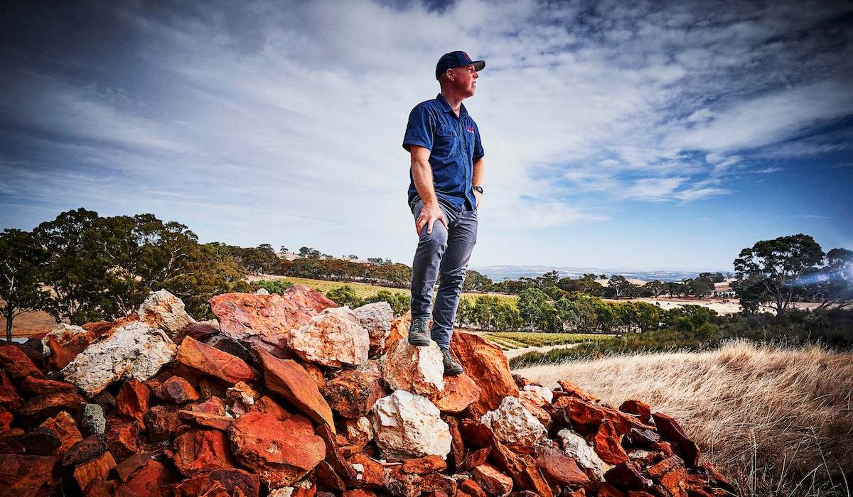 man standing on rocks at HEAD Wines