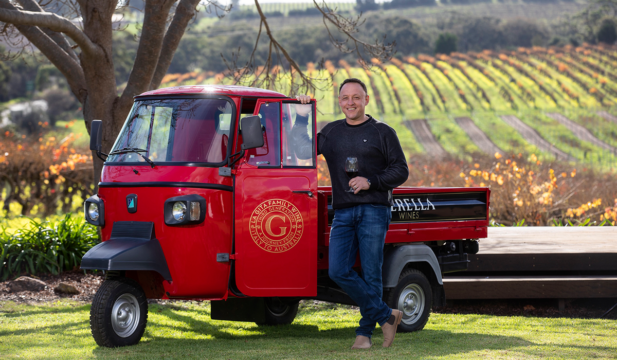 Man in front of vineyard