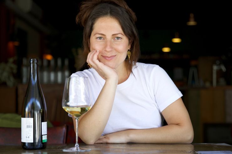 Bridget Raffal from Where's Nick poses with a glass of white wine