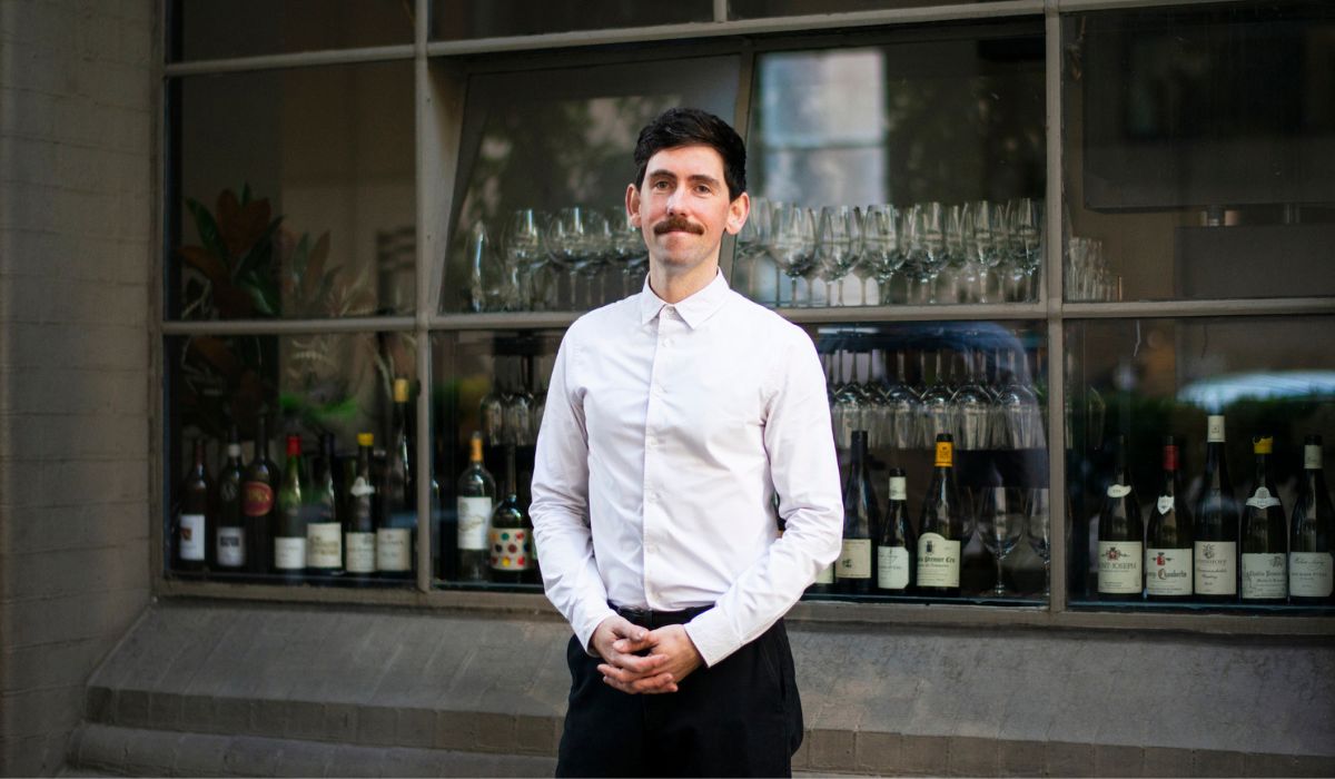 Sommelier Chris Ryan stands in front of Cumulus Inc.