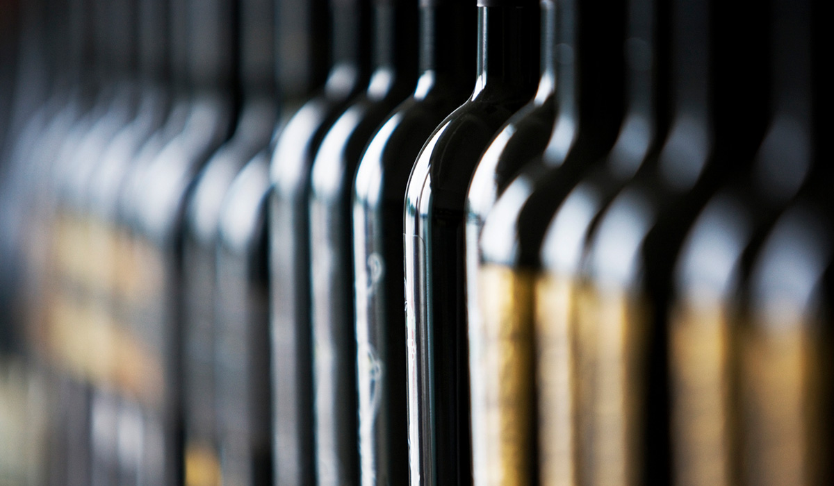 Wine bottles in a row, selective focus