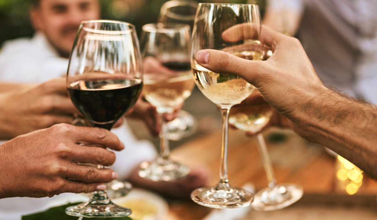 A group of people toasting with wine glasses