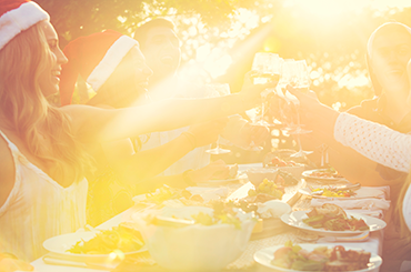 Group of people toasting wines at Christmas Australia