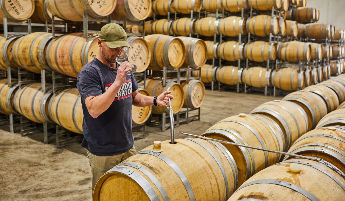 Glenn Goodall tastes wine from the barrel at Xanadu