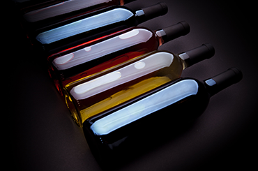 Wine bottles lying in a row