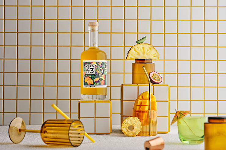 Tropical gin displayed with glassware and fruit