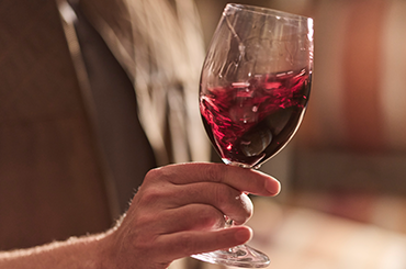 Glass of red wine being swirled