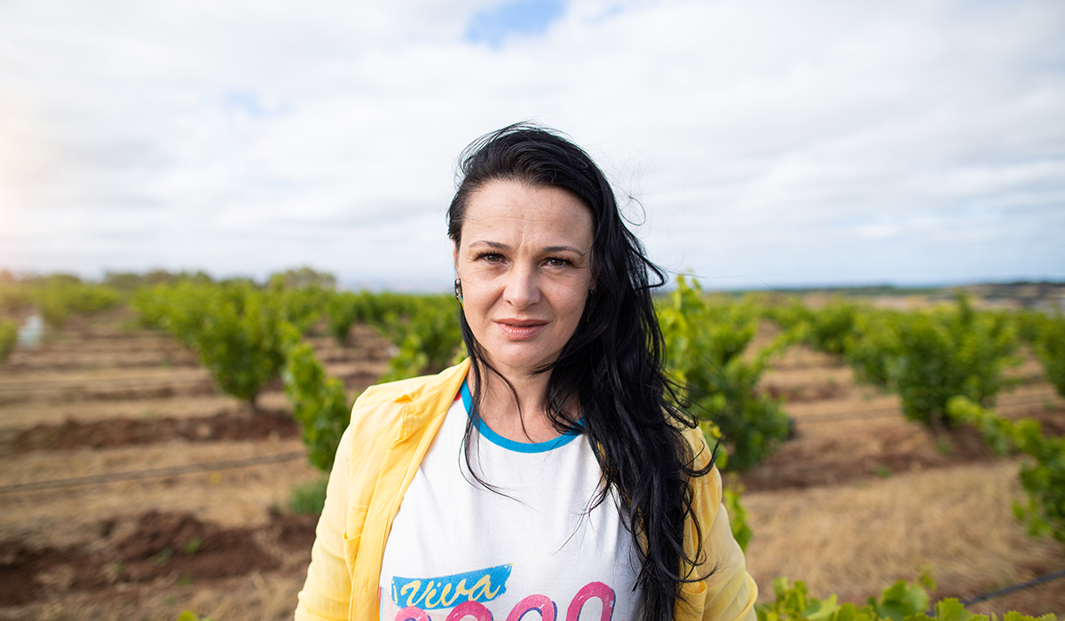 Elena with the vineyard behind her