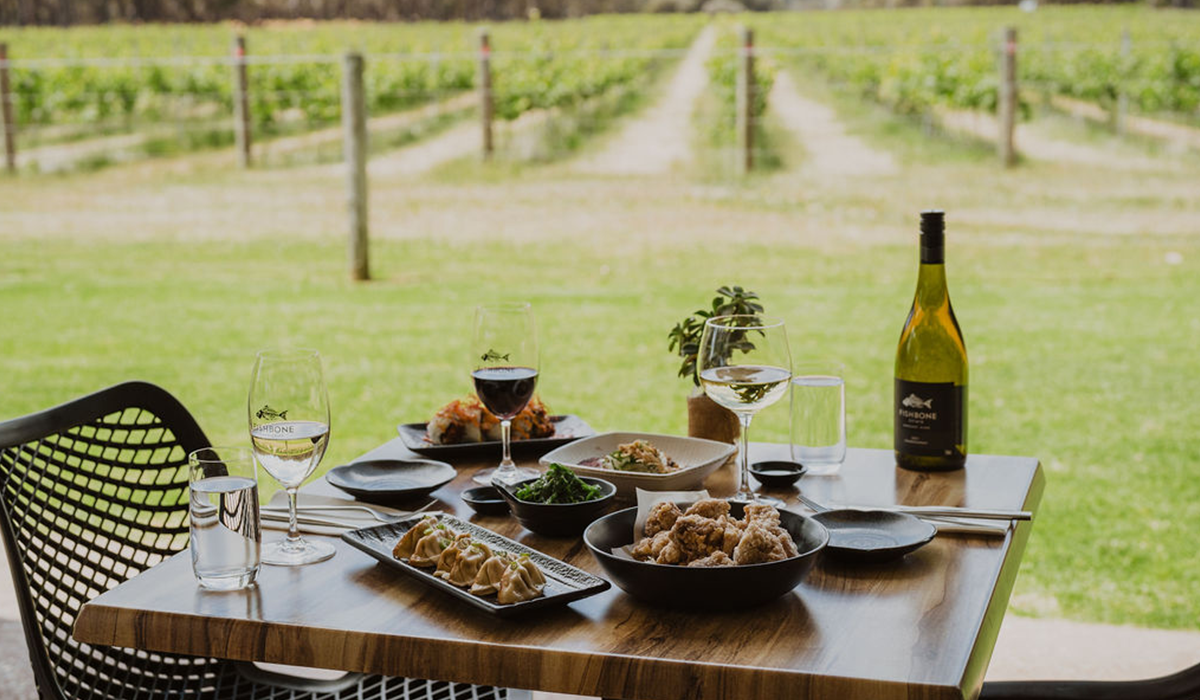 Fishbone wines and food on table