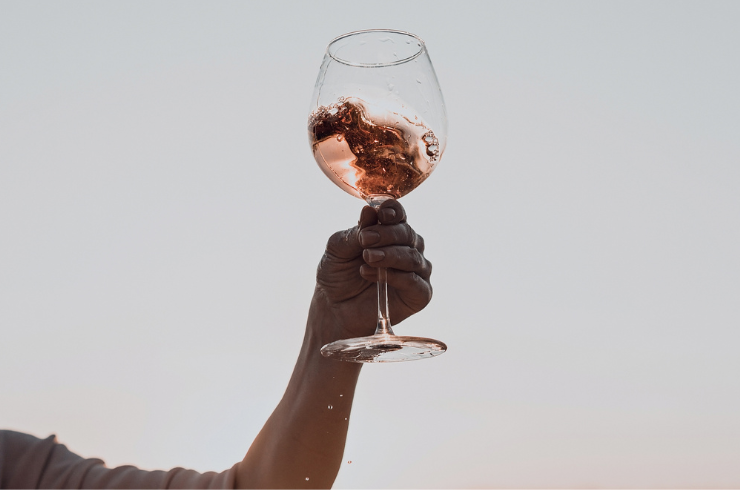 A glass of pink wine