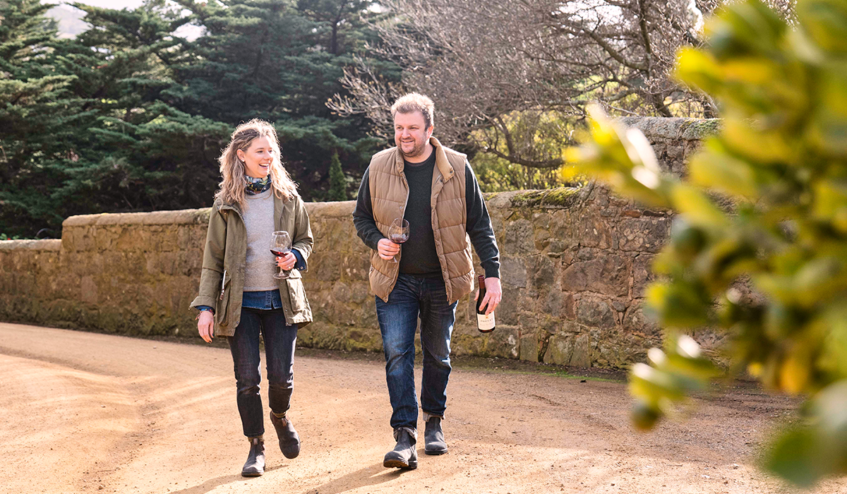 Anna and Justin walking in the cellar door.