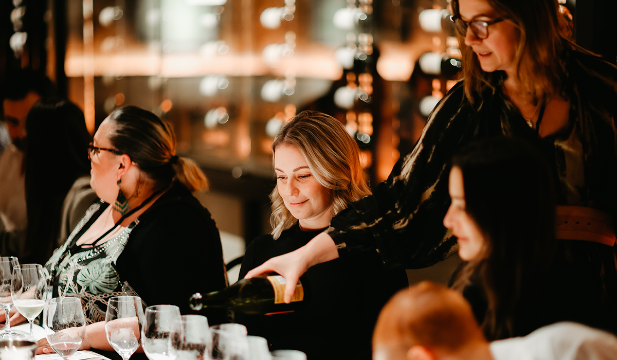 Wine being poured at a masterclass event.