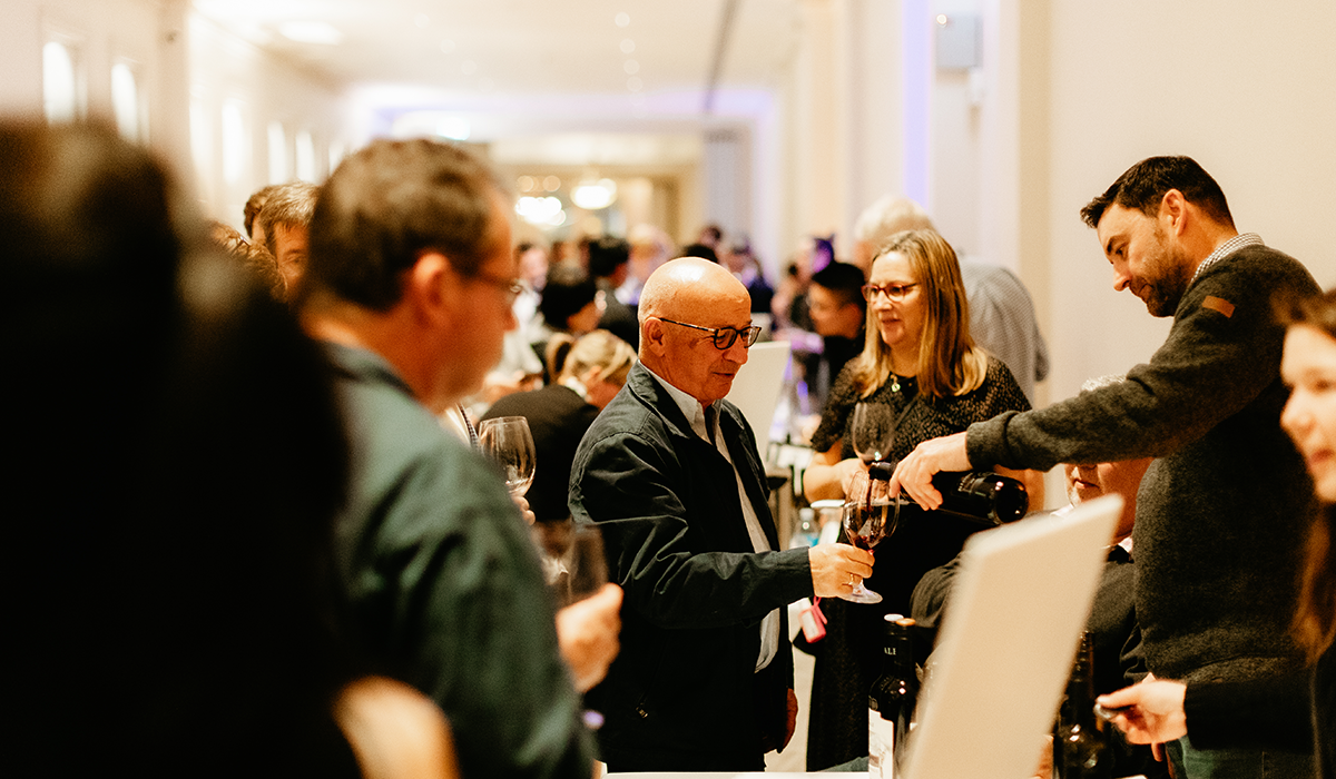 A guest being poured a wine at a Halliday sip series event.