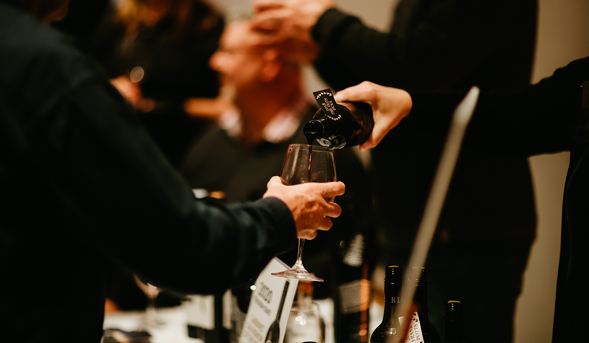 Wine being poured into a glass.