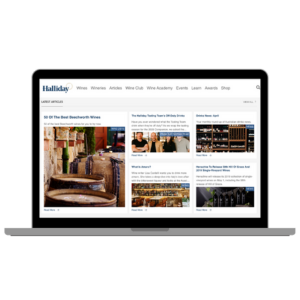 Laptop with Halliday website on screen.