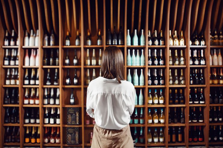 a person shopping for wine