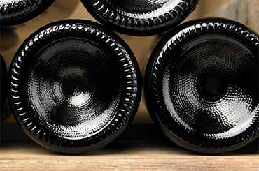 Wine bottles in cellar tile