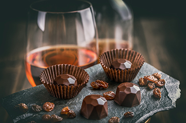 Chocolate truffles with glasses of wine