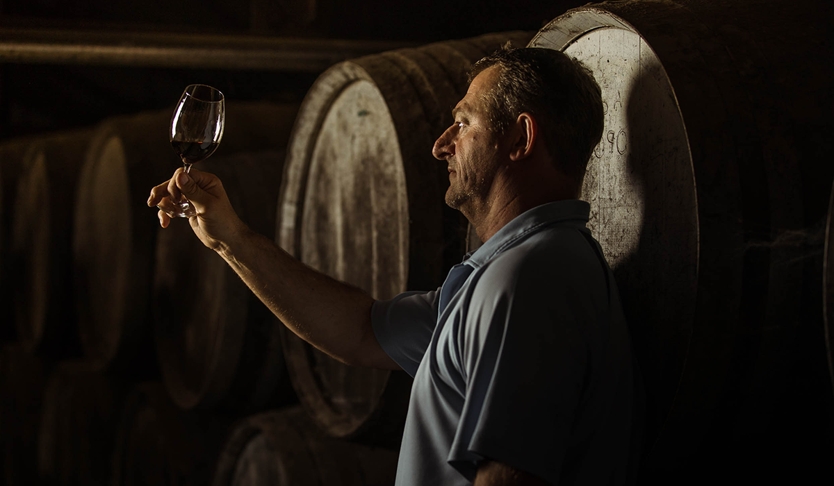 McWilliams winemaker holding a glass of fortified