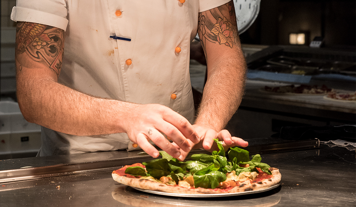 Chef making a pizza