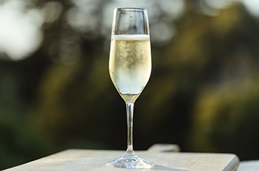 A glass of sparkling white wine